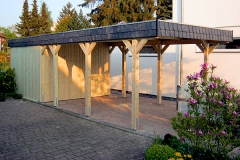 Einzelcarport Akzent mit Geräteraum und Naturschieferblende